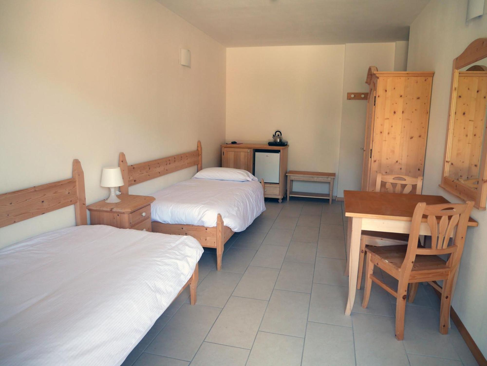 Hotel Elbele Garni Folgaria Rum bild